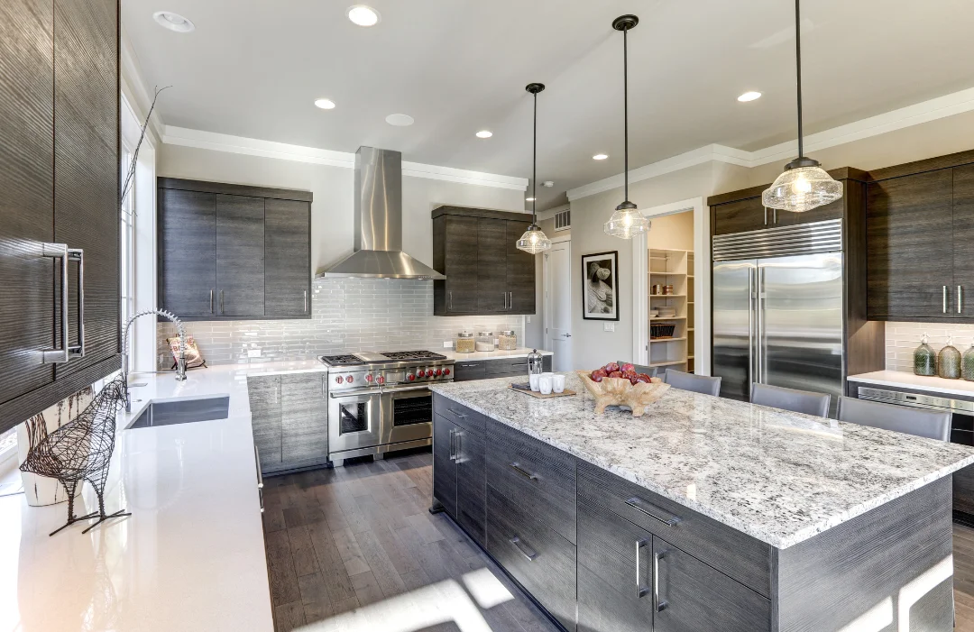 CMS-High-end-Kitchen Modern kitchen in greys, browns and earthy textures (wood floors, wood cabinets), quartz countertops and stainless appliances.