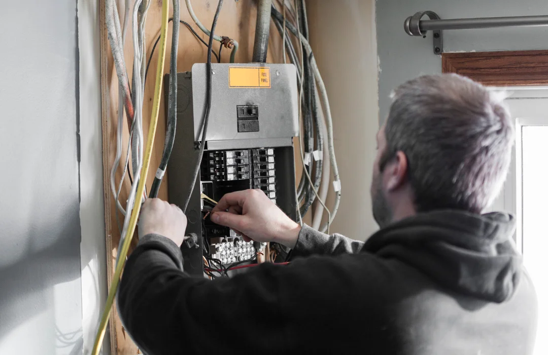 Electrician working on a panel